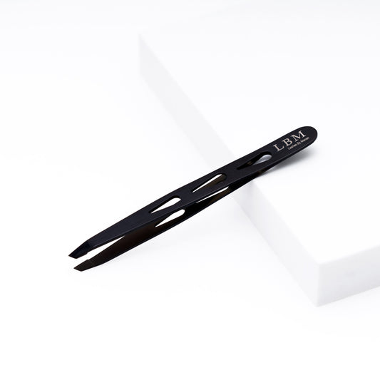 Black slant-tip tweezers with 'LBM' branding on a white background