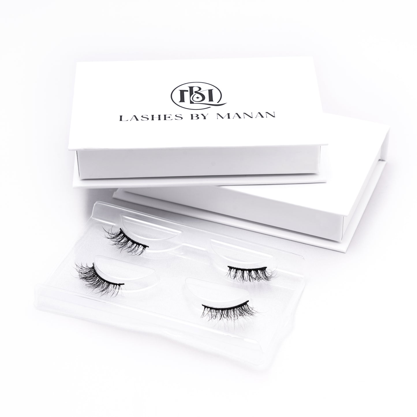 Set of false eyelashes HS22 in a 'Lashes by Manan' box on a white background