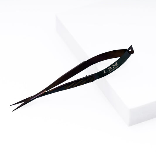 Black Eyebrow Scissors with 'LBM' branding on a white background