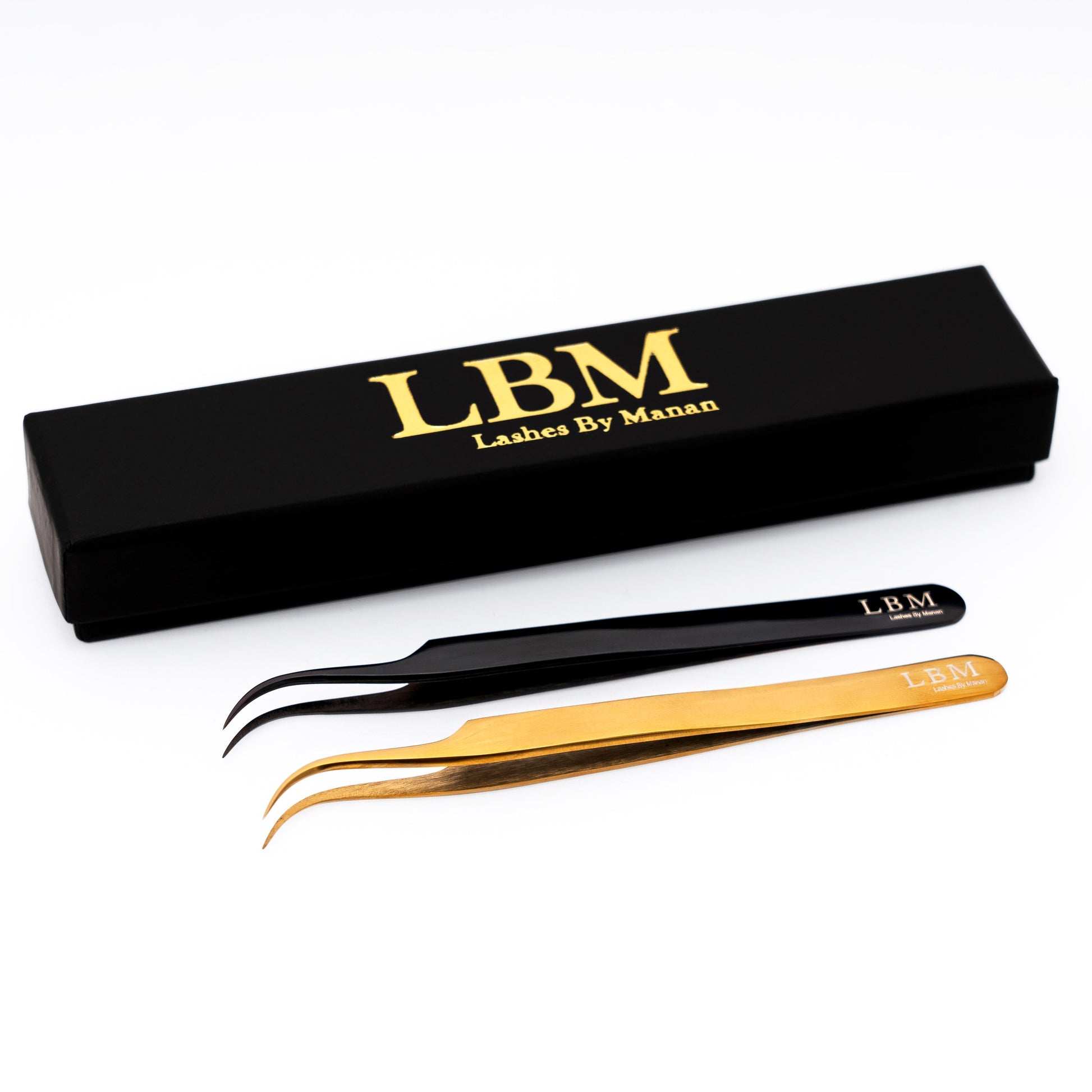Eyelash extension tweezers with black and gold handles and 'Lashes By Manan' branding on a white background.