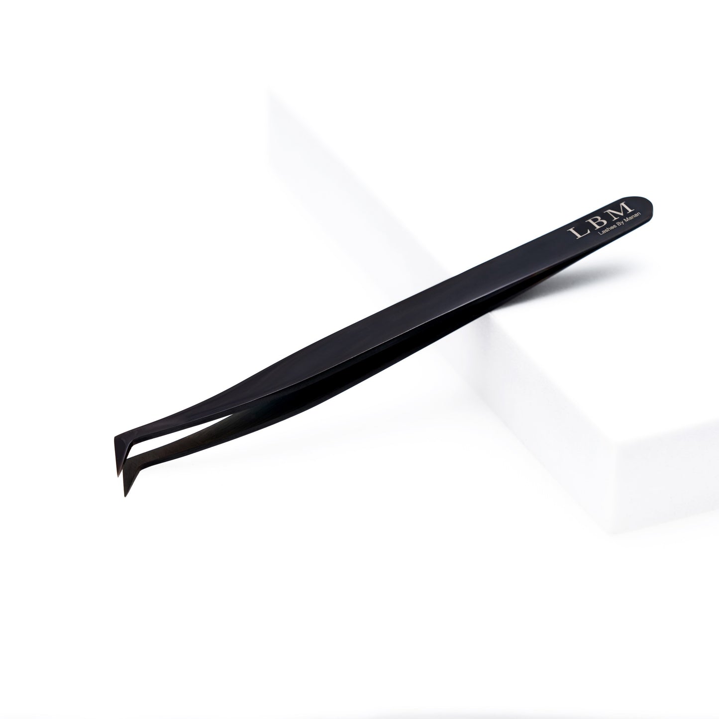 Black slant-tip tweezers with 'LBM' branding on a white background