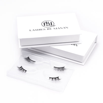 Set of false eyelashes HK09 in a 'Lashes by Manan' box on a white background