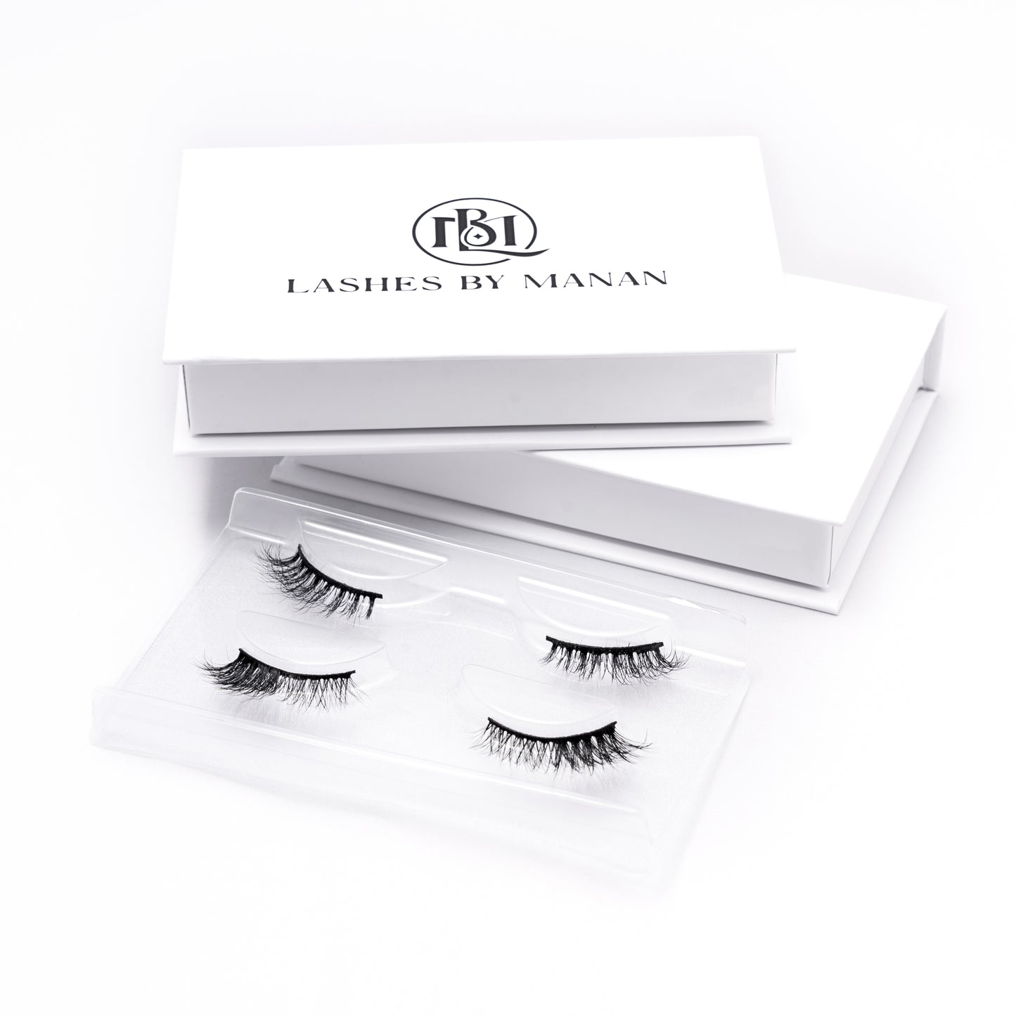 Set of false eyelashes HS04 in a 'Lashes by Manan' box on a white background