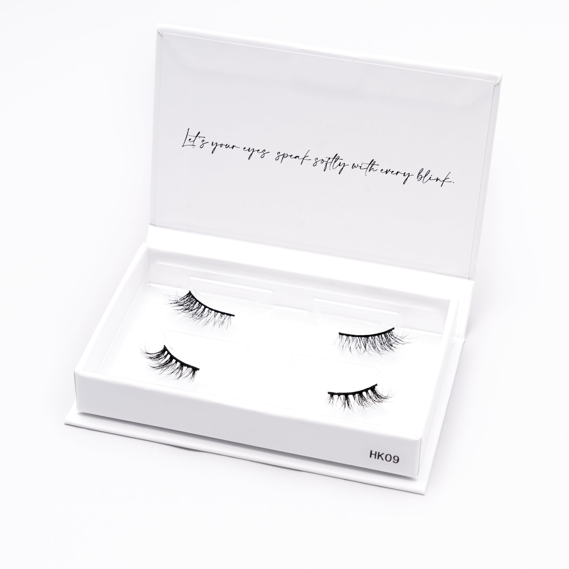 Set of 2 pairs of 3D Mink Lashes style HK09 in a white box with text on a white background